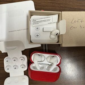 Apple AirPods Pro 2 like new with Vibrant Red Case and extra earbud.